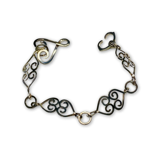 Unieke schakelarmband met harten en stevige ogen