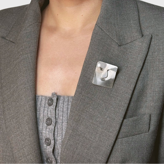 Zilveren broche gezichtje